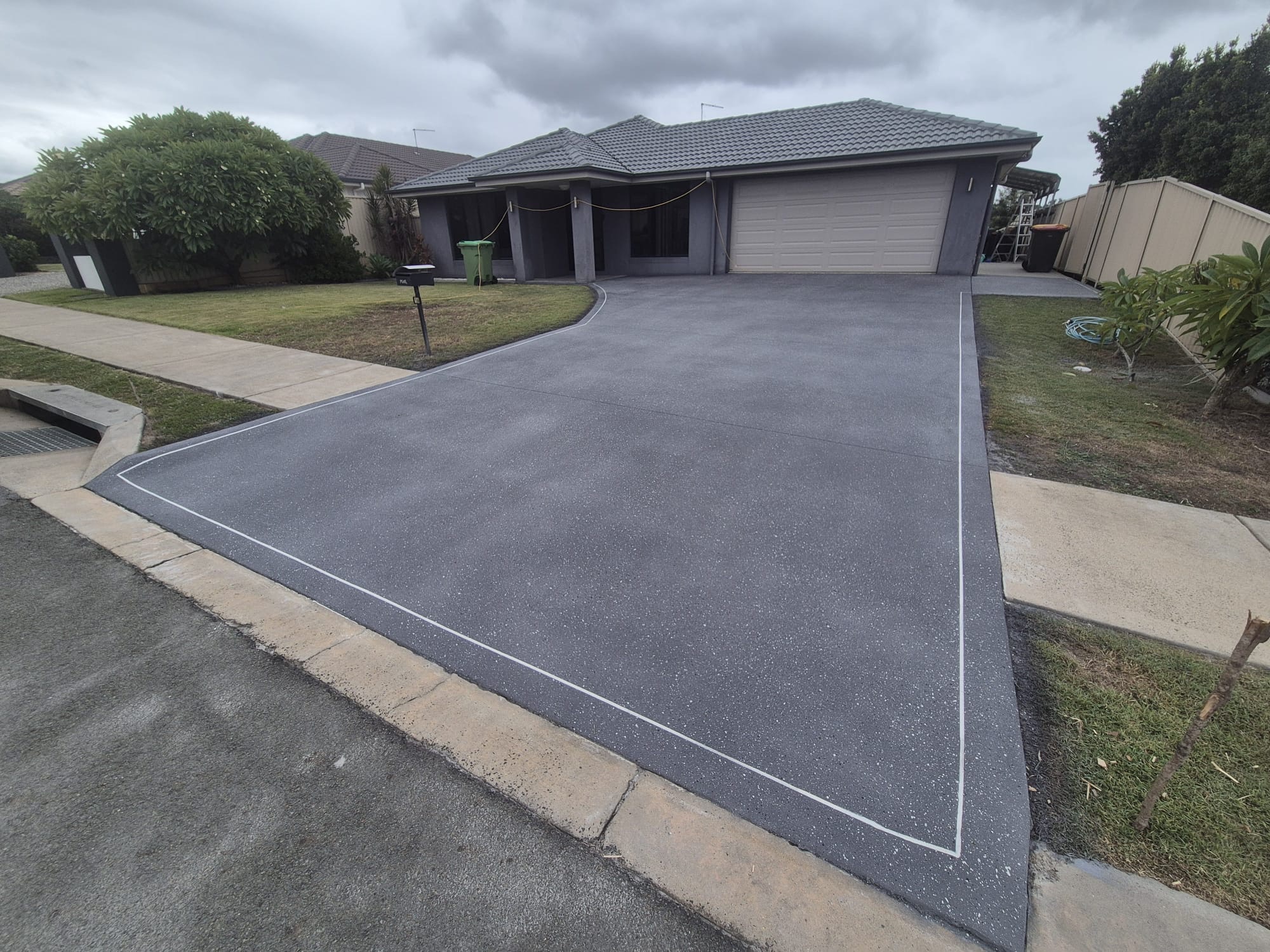 Driveway after covercrete resurfacing - Blue Mountain colour with fleck finish